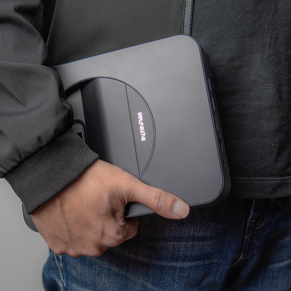 INNOVATIVE DSX Ultra Short Throw Projector holding in the hand