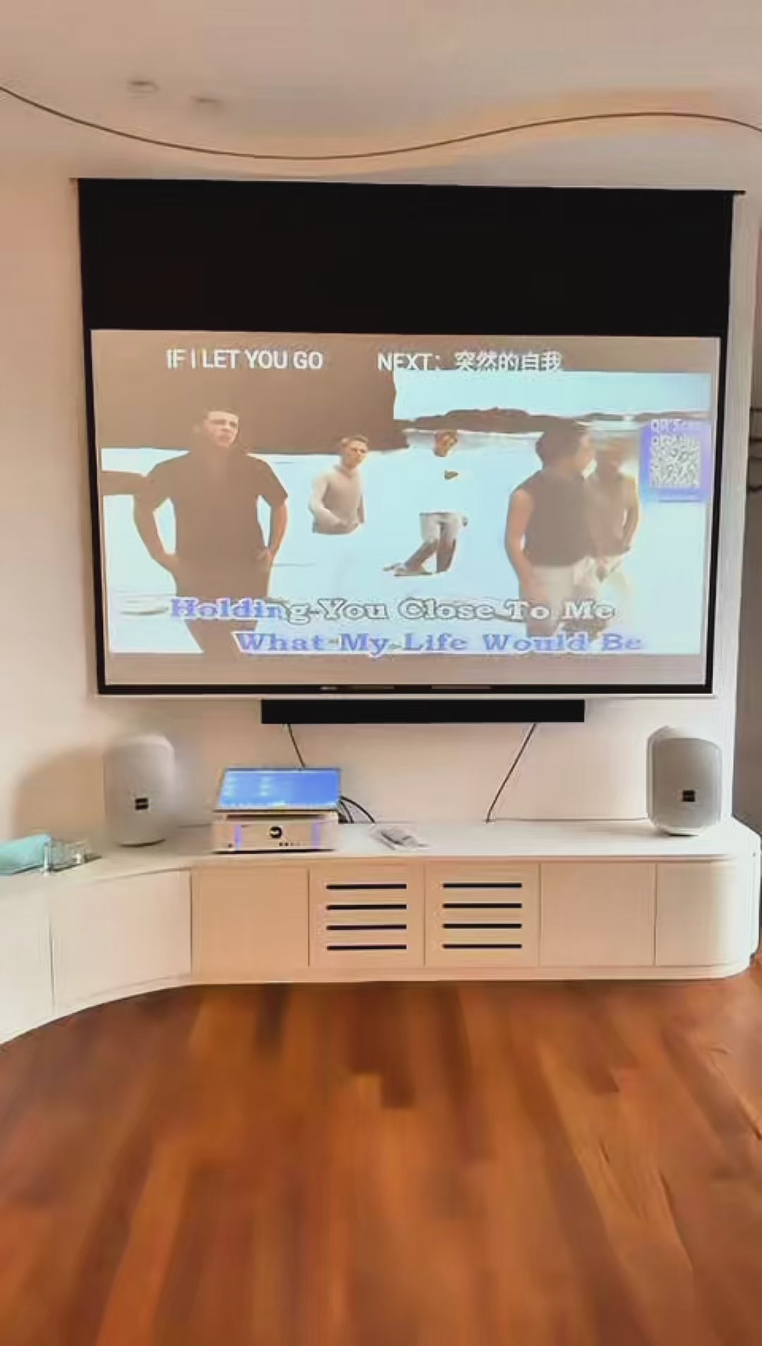 Eva Vela 360 gimbal projector rotating upward to project a movie onto the bedroom ceiling