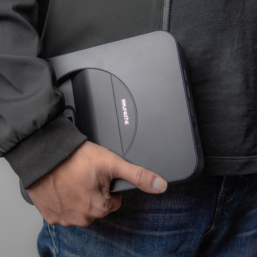 INNOVATIVE DSX Ultra Short Throw Projector holding in the hand